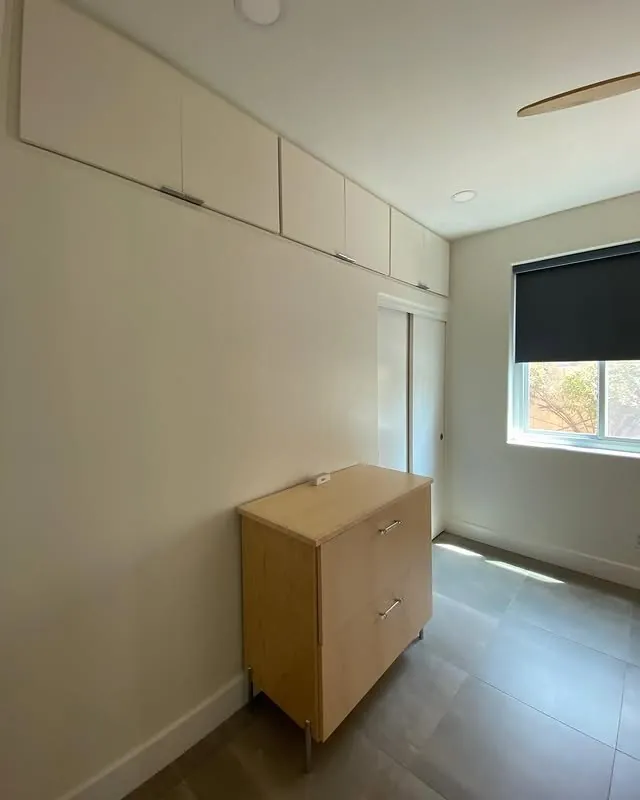 Maple filing cabinet against a painted wall in the office