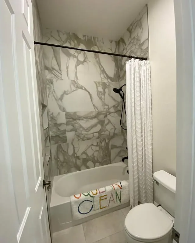 Tub and shower with large-format marble-look tile