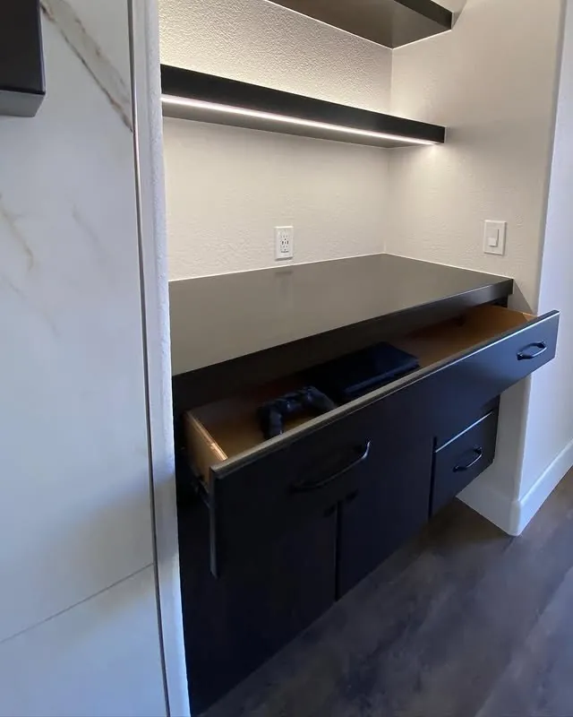 Floating media cabinet with an LED strip under the shelf above