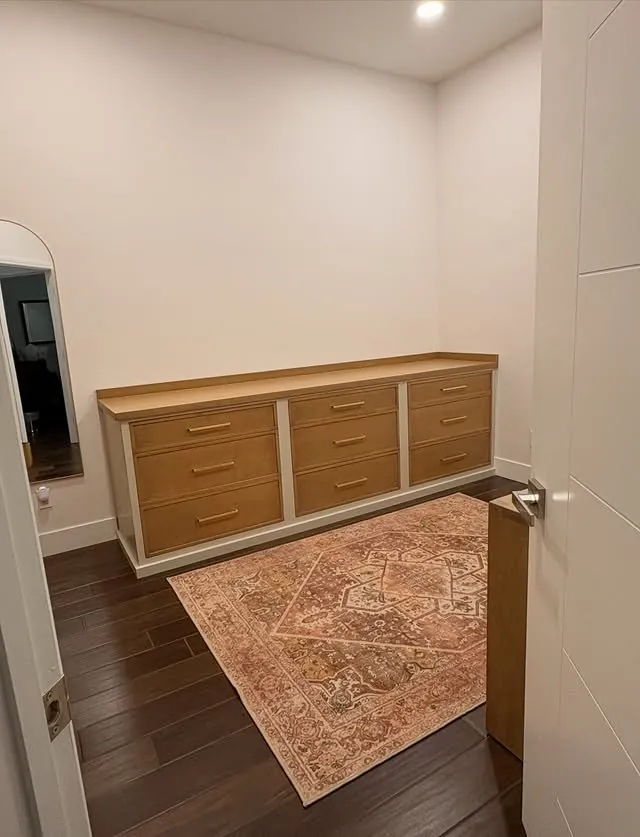 Low cabinet with drawers for wrapping supplies and suitcases