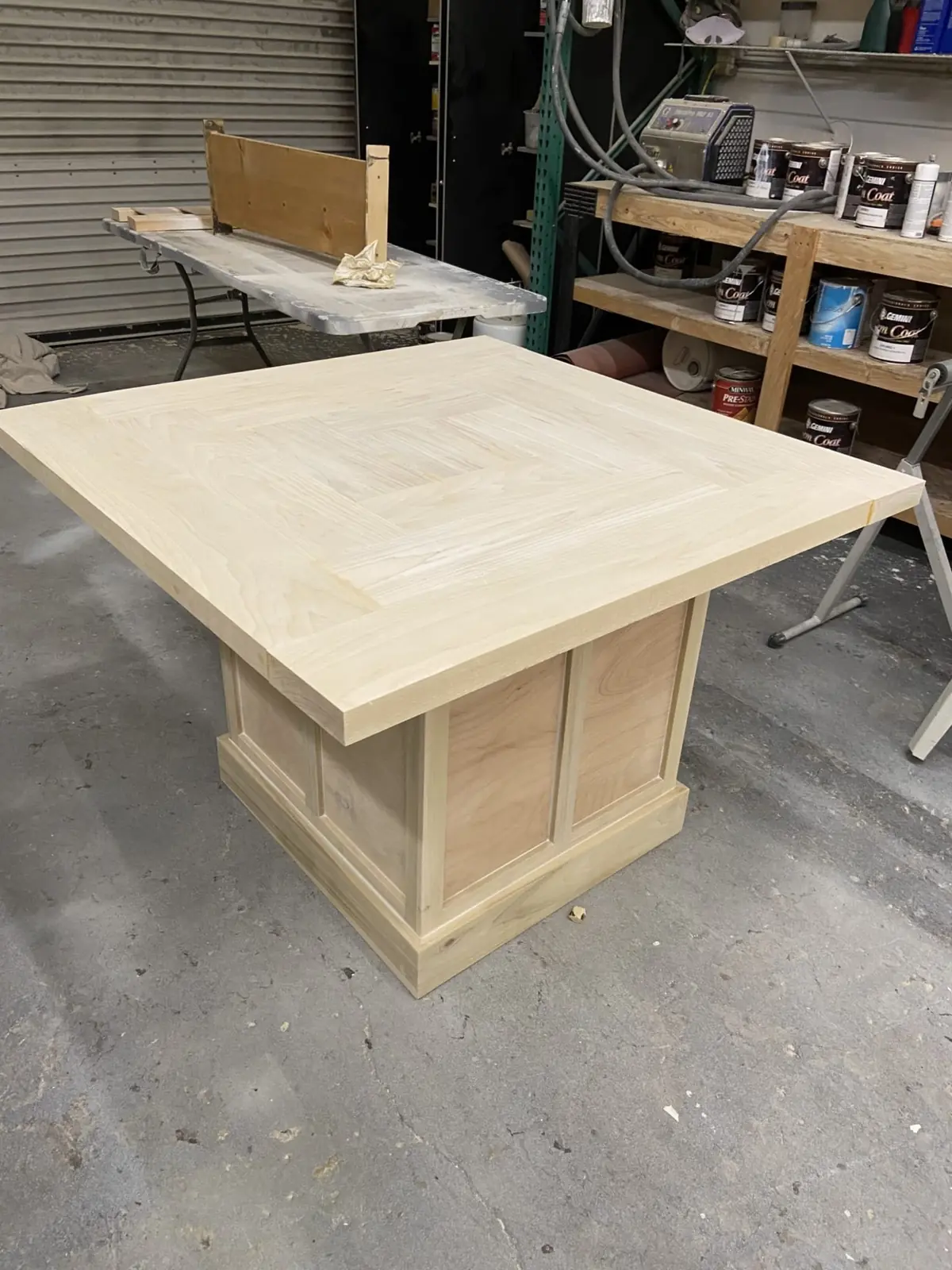 A square table under construction in the workshop