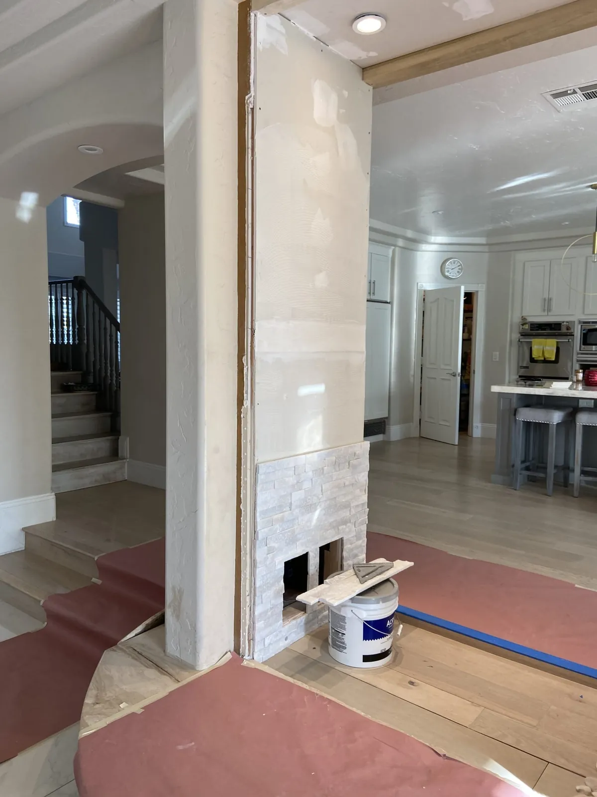 The column during construction, with the old fireplace opening at its base